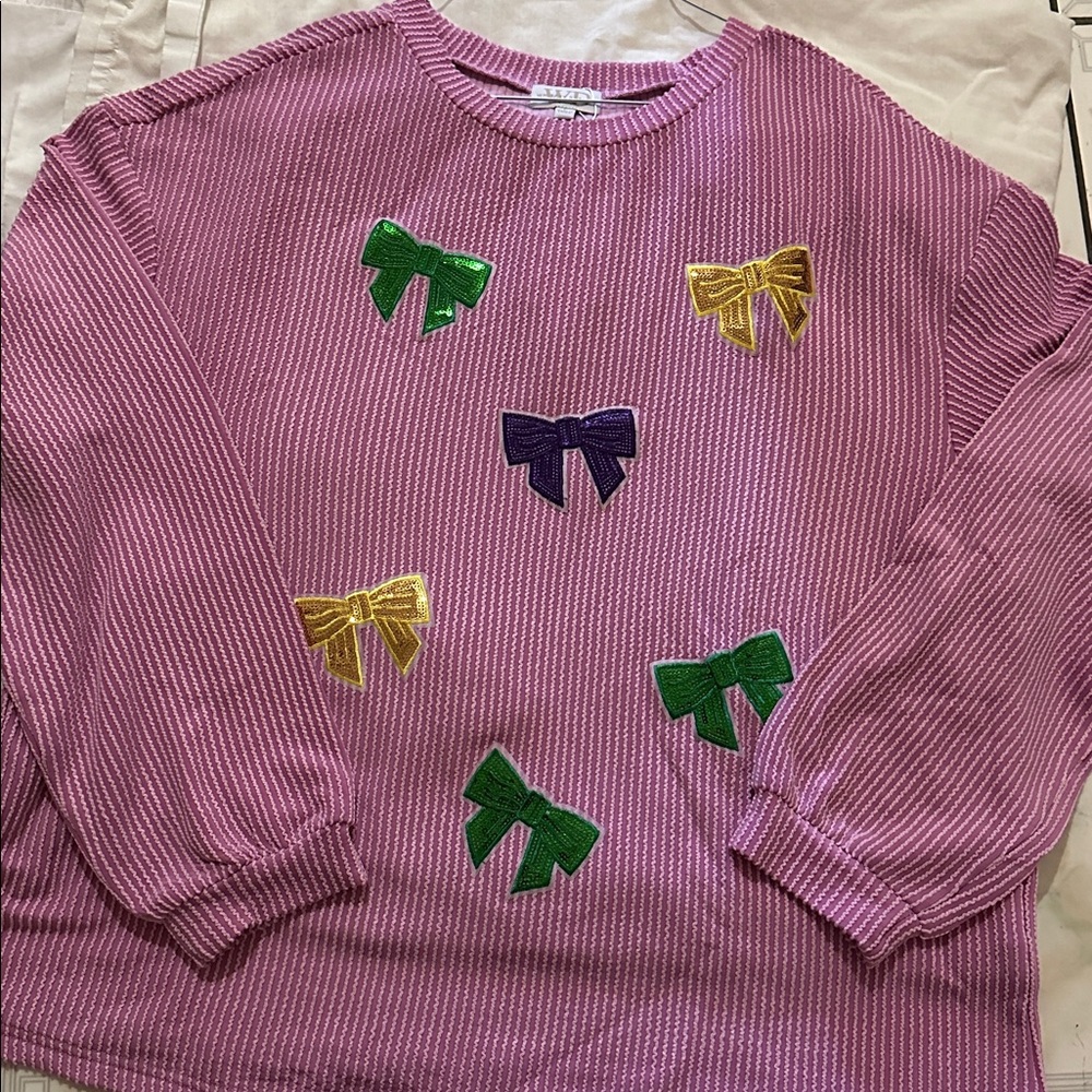 Pink Sweater with Colorful Bow Accents